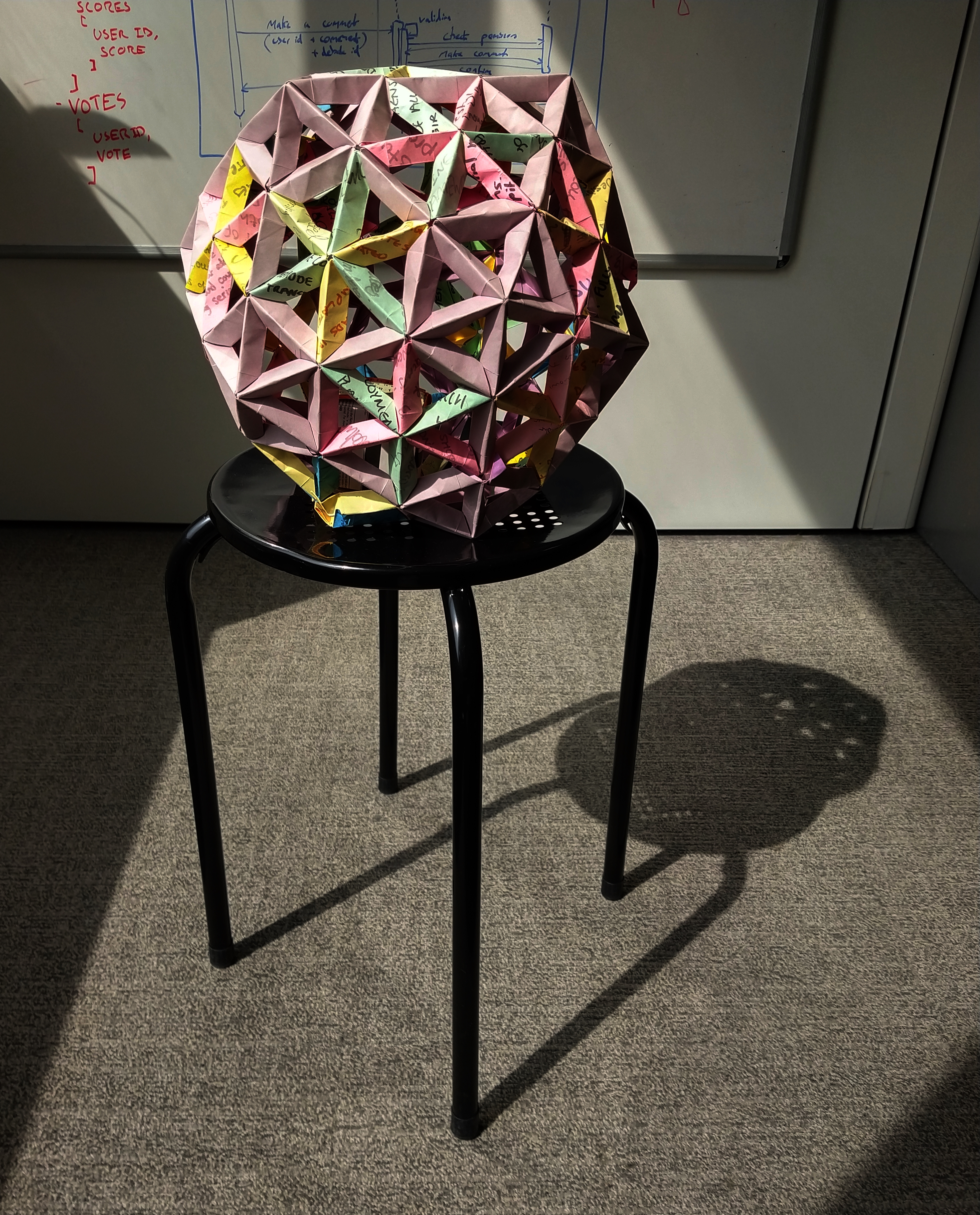Image: Example of Tomoko Fuse's Open Frame II units forming a truncated icosahedron. NB: some corners have 5 edges, and others have 6.